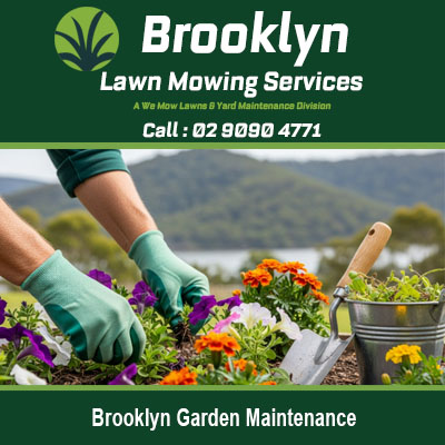 Brooklyn garden maintenance NSW with gardener planting colorful flowers in residential garden beds
