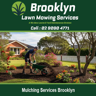 Mulching services Brooklyn NSW with landscaper using wheelbarrow to spread mulch in garden beds